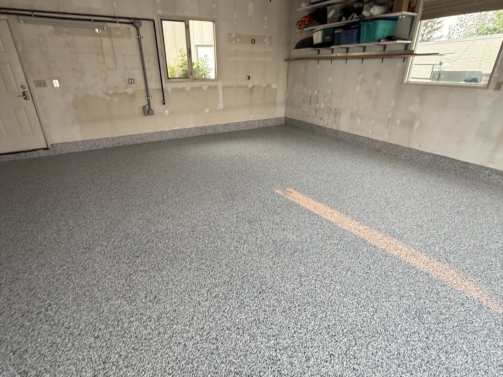 Bare-wall garage, freshly finished flake floor